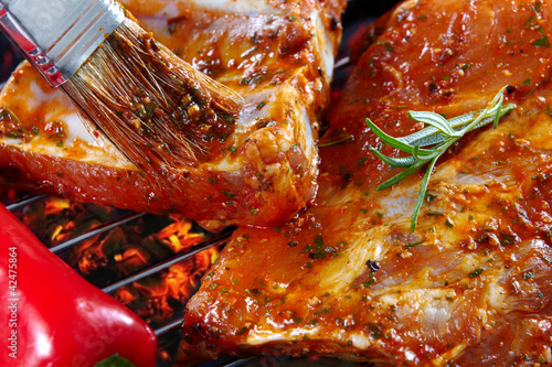 raw pork ribs on grill