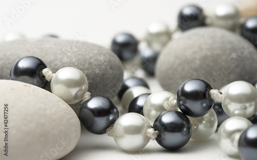 String of black and white pearls with stones
