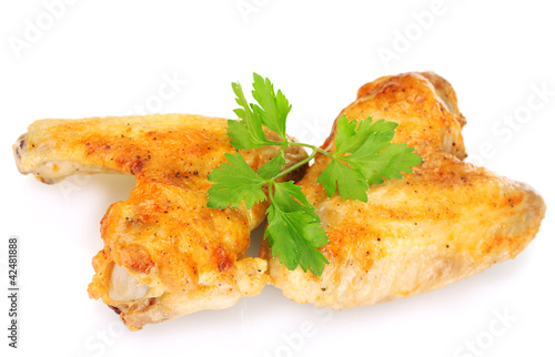 roasted chicken wings with parsley isolated on white