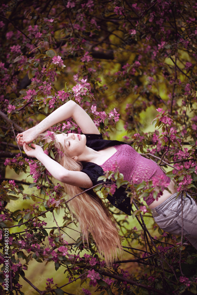 Beautiful woman and flowering tree Beautiful woman and flowering tree