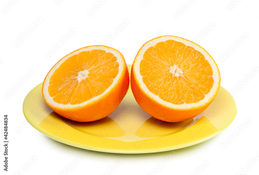 Cut orange on plate. Cut orange on plate.