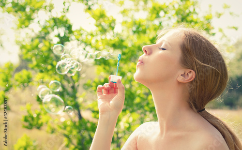 beauty girl and bubbles on the nature