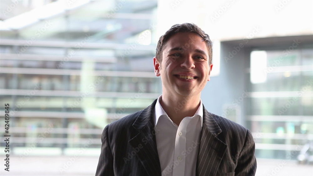 Business man cheering with clenched fists