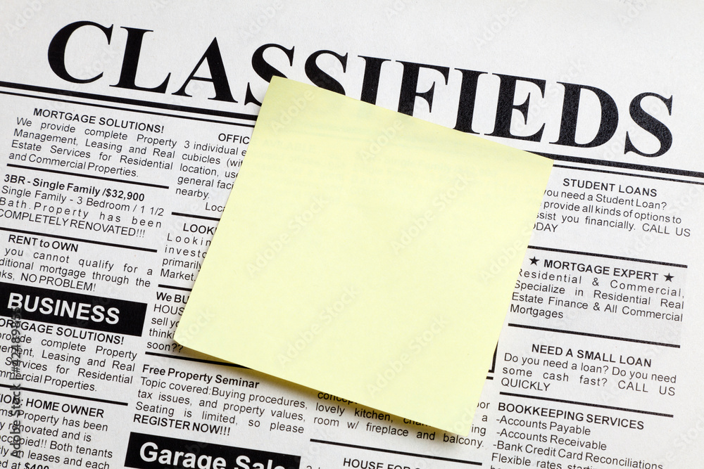 Obraz premium Newspaper and sticky note