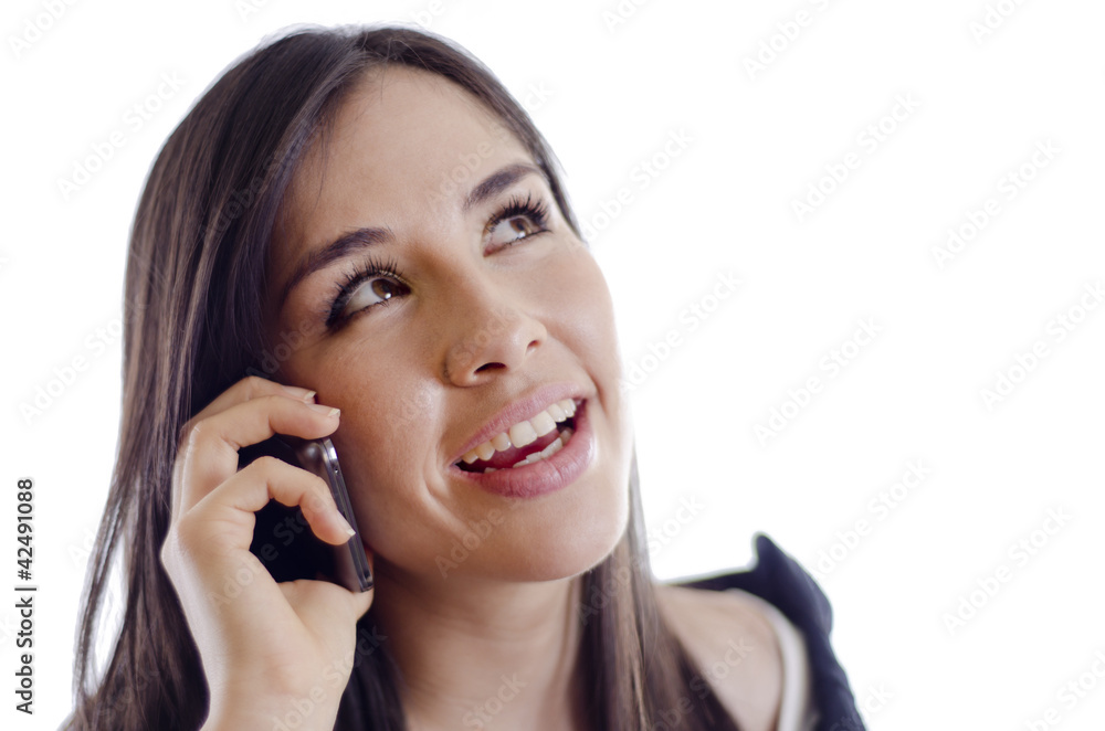 Young beautiful woman on the phone and looking at copy space Young beautiful woman on the phone and looking at copy space