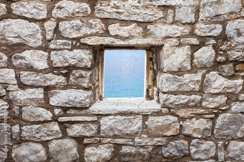 Old wall with window seaview