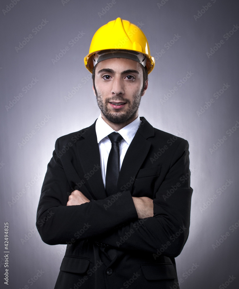 Young investor with construction helmet Young investor with construction helmet