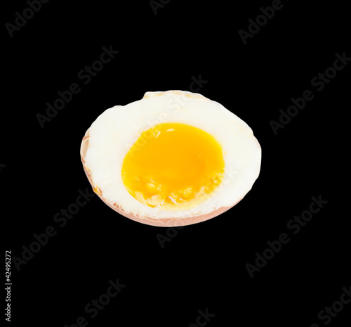 soft-boiled egg on a black background
