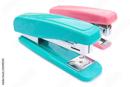 blue and pink staplers with clipping path