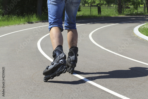 A man on roller skates in stadium