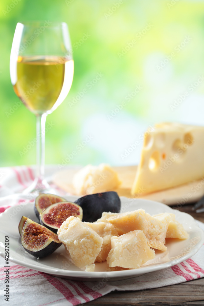 Cheeses, figs, and wine Cheeses, figs, and wine
