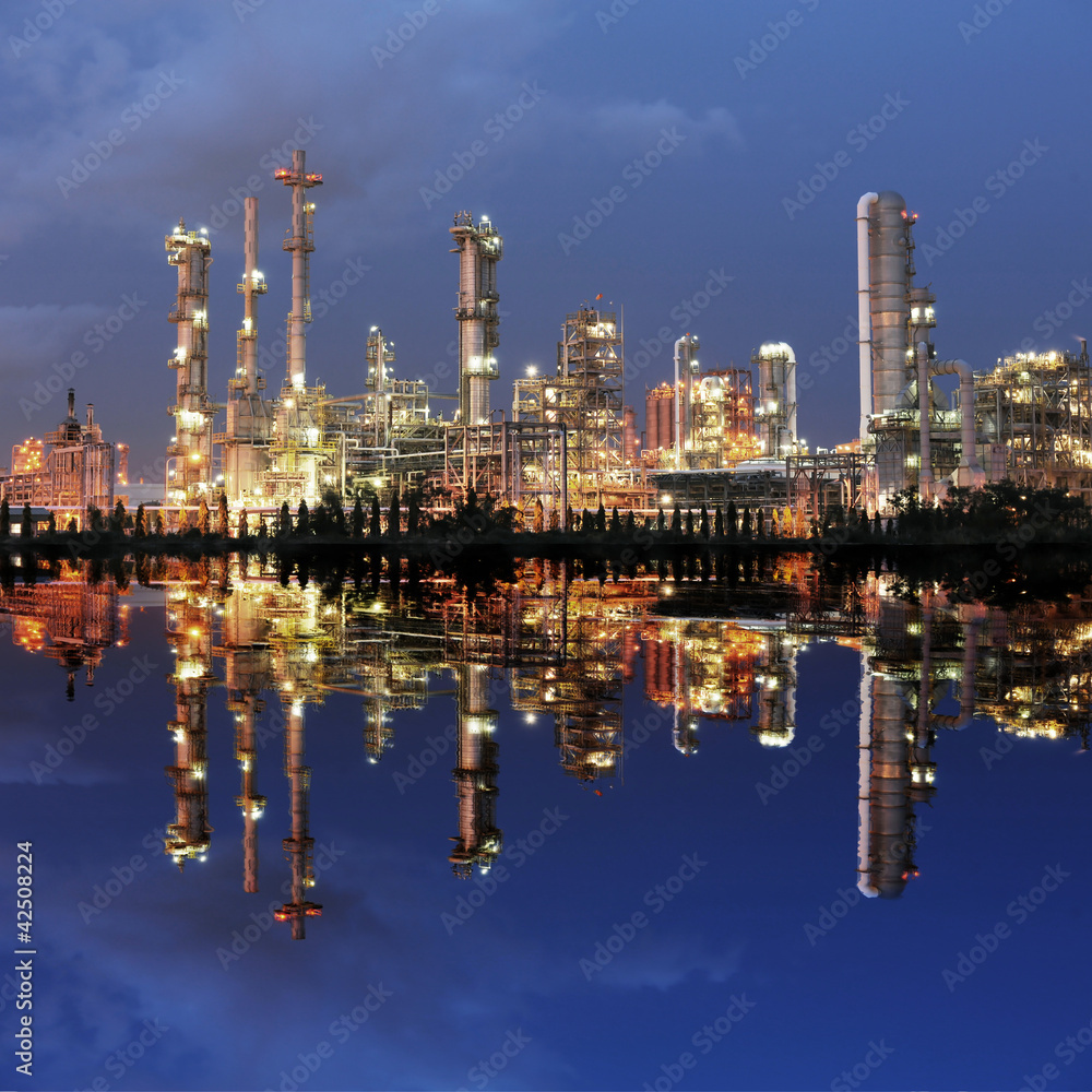 Naklejka premium Reflection of petrochemical plant at night