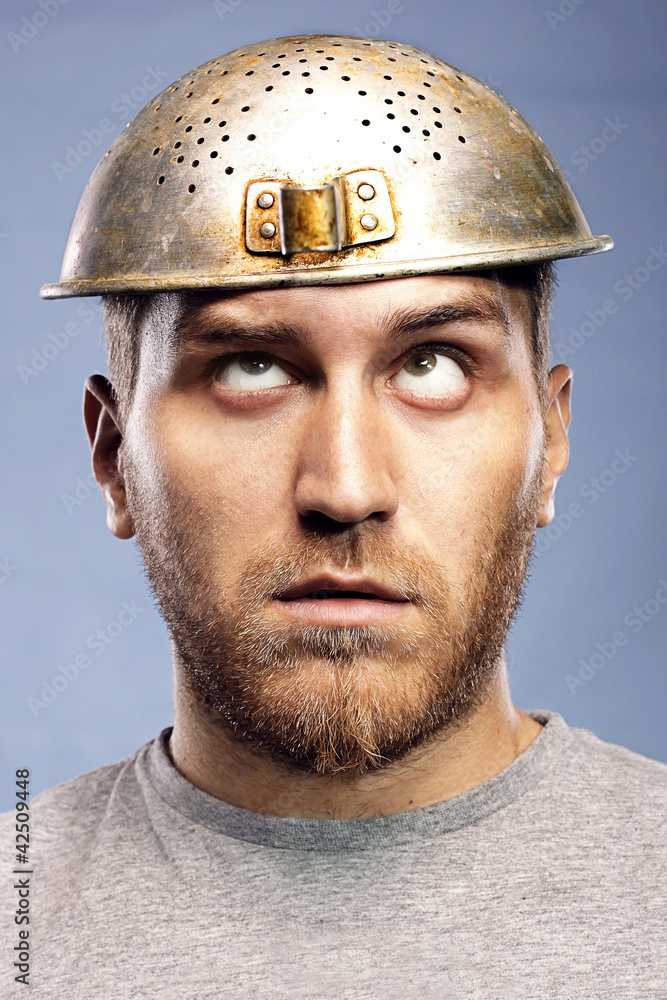 portrait of a man with a colander on his head portrait of a man with a colander on his head