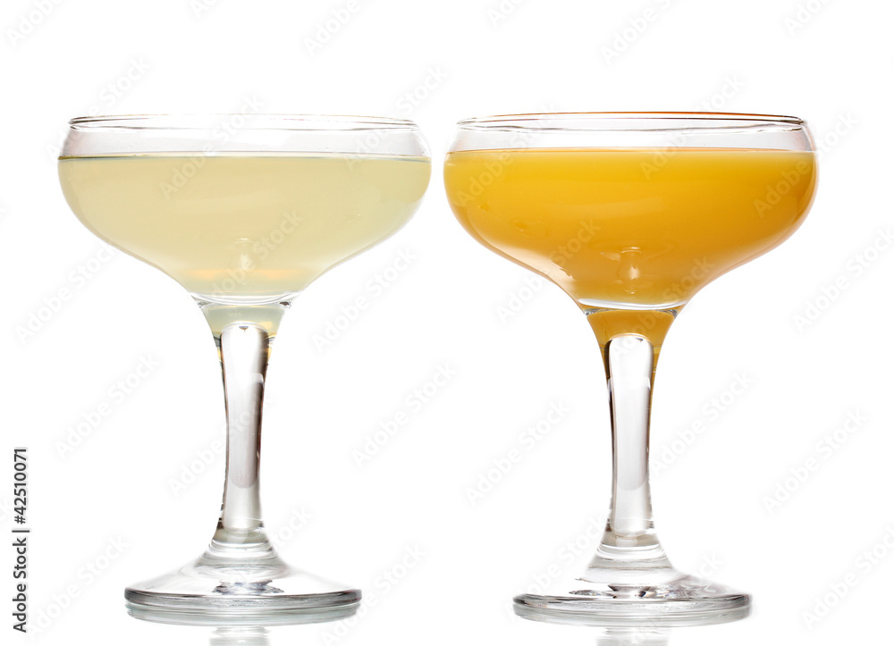 Tropical juices in glasses isolated on white Tropical juices in glasses isolated on white