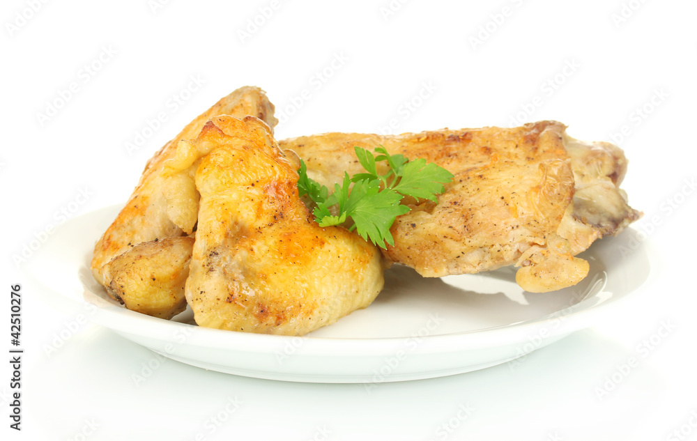 roasted chicken wings and leg with parsley in the plate roasted chicken wings and leg with parsley in the plate