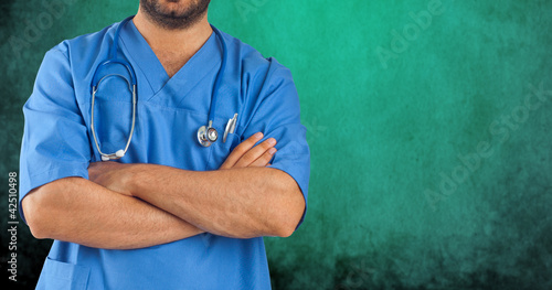 Male nurse on green background photo