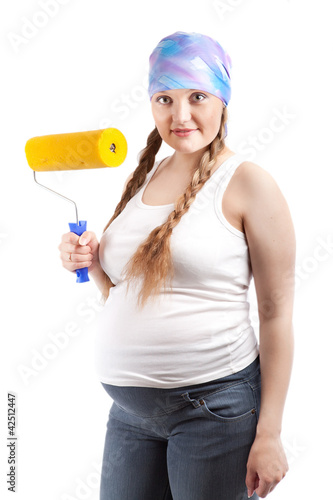 Pregnant woman and repair, studio photo
