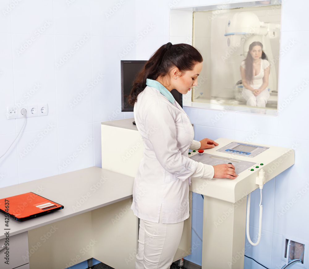 Patient and doctor in x-ray room.