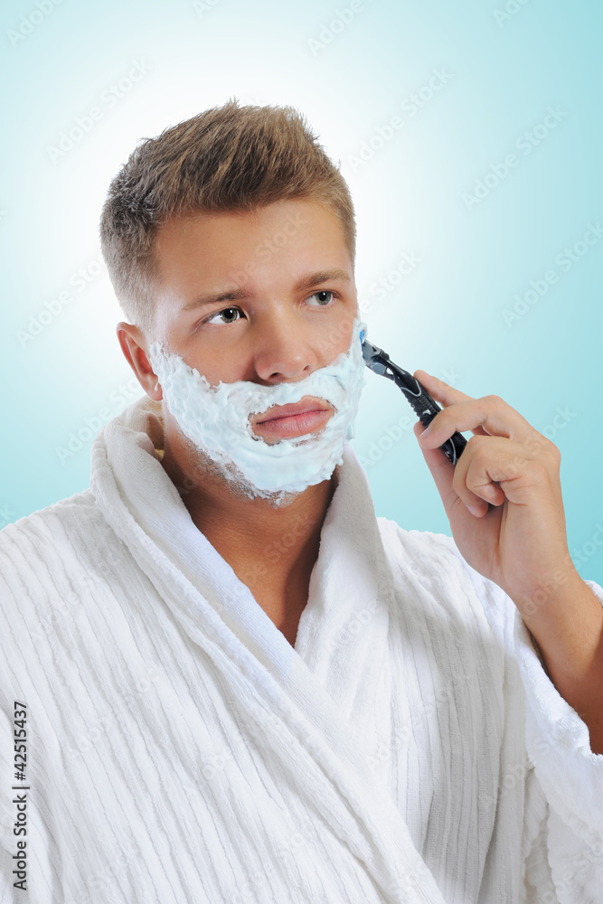 Young man shaving