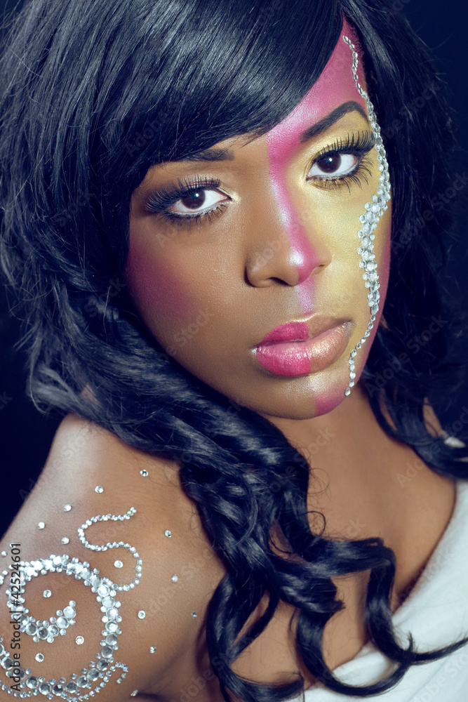 Fototapeta premium Beautiful young woman with colorful makeup, closeup shot