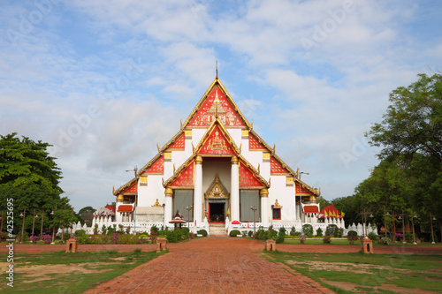 Buddhism white church with brick path walk. © keerati