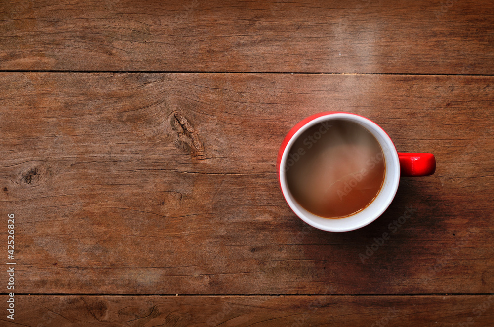 red cup coffee on wood background red cup coffee on wood background