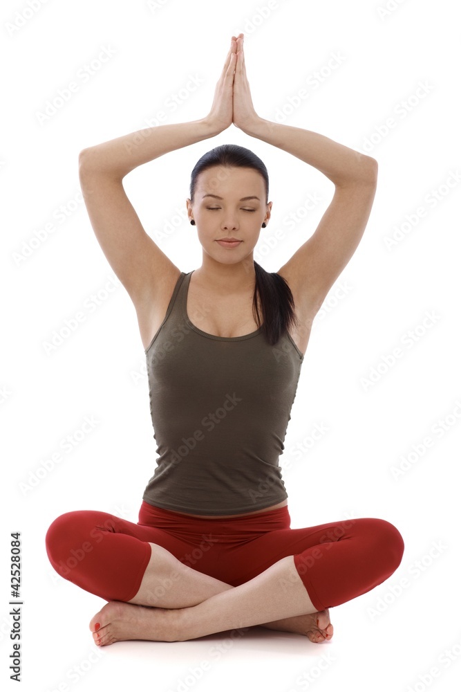 Attractive woman practicing yoga eyes closed Attractive woman practicing yoga eyes closed
