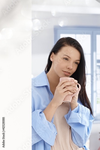 Young woman with morning tea