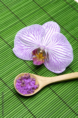 macro of orchid and bath salt in spoon flower on green mat