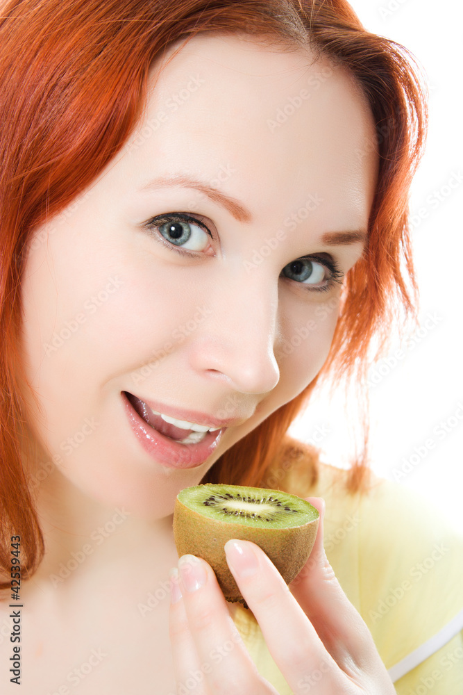 Young woman with kiwi in the hands