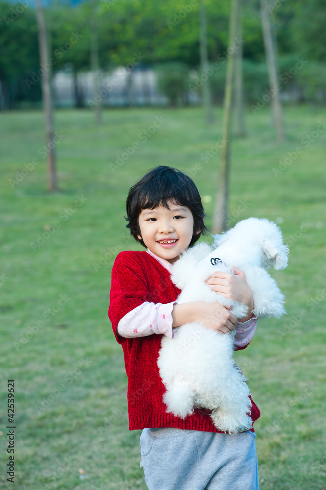 Asian kid holding dog Asian kid holding dog
