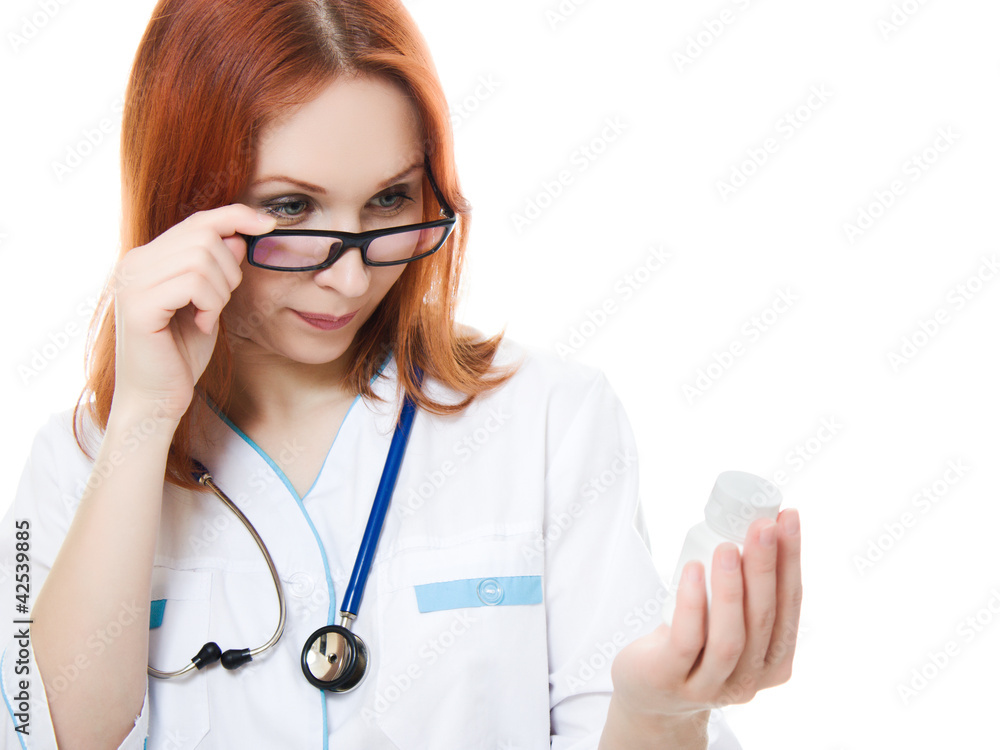 The doctor woman holding a container of vitamins The doctor woman holding a container of vitamins