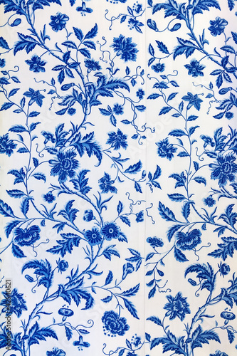 Blue floral pattern on the wallpaper