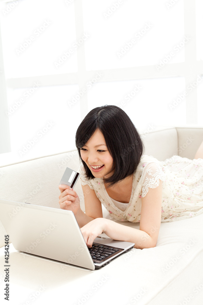 Beautiful young woman using a laptop computer. Portrait of asian Beautiful young woman using a laptop computer. Portrait of asian