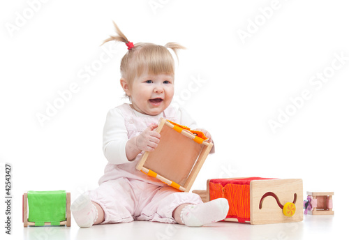 smiling baby girl playing w...