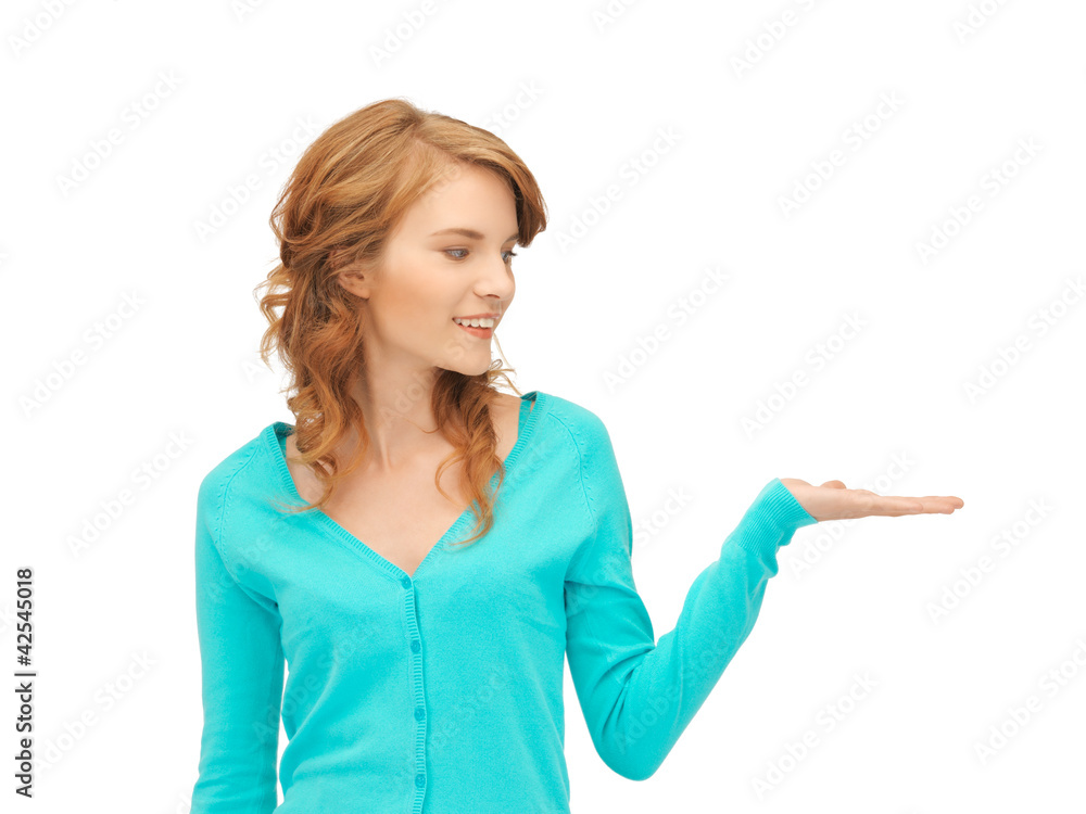 girl showing something on the palm of her hand girl showing something on the palm of her hand