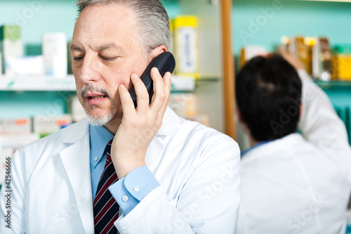 Pharmacist talking at the phone