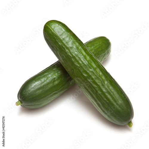Mini Cucumbers isolated on a white studio background.