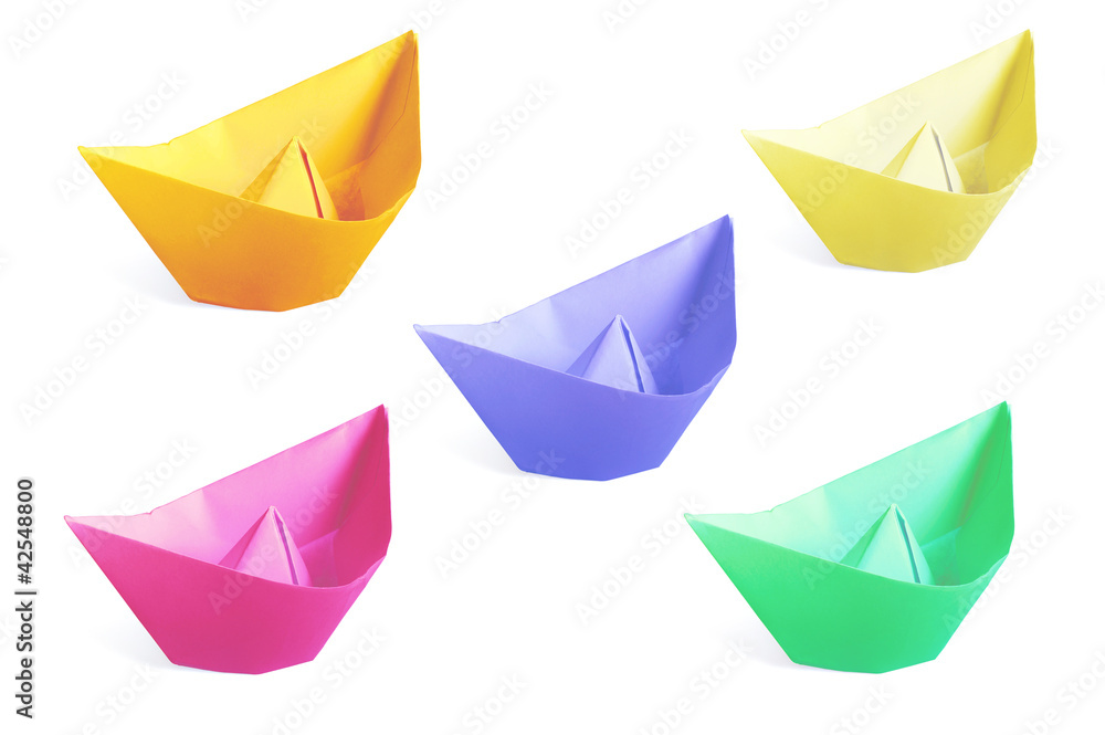 Naklejka premium Colorful paper ships isolated on a white background