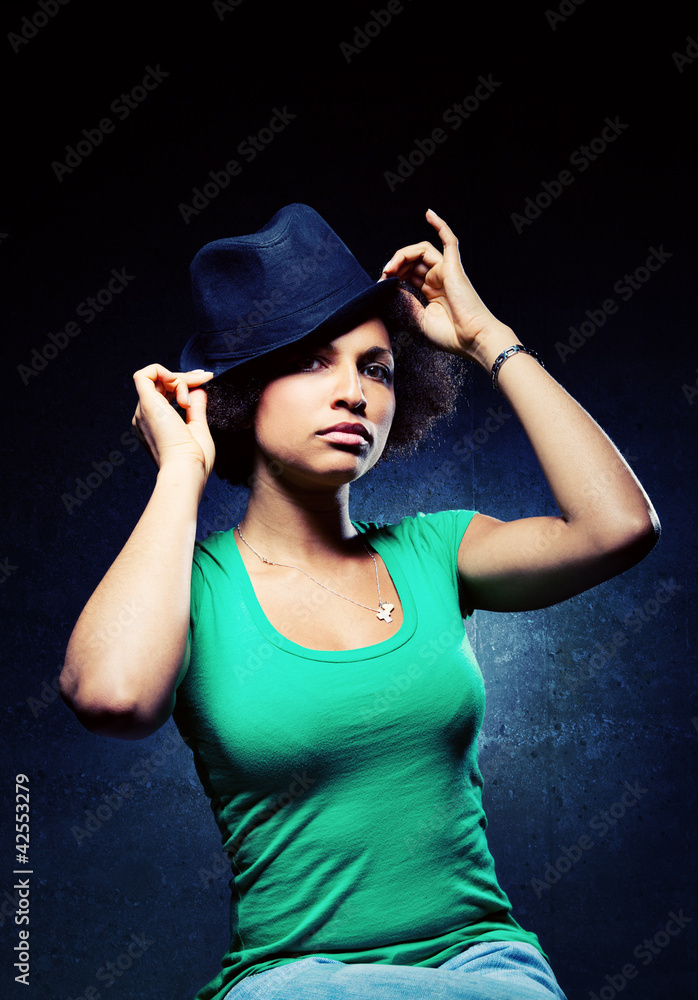 Cute Black Woman Wearing a Hat with Serious Expression Cute Black Woman Wearing a Hat with Serious Expression