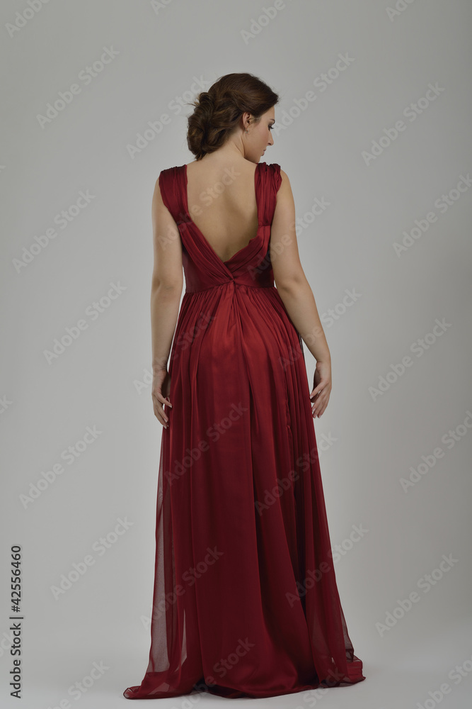 elegant woman in fashionable dress posing in the studio elegant woman in fashionable dress posing in the studio