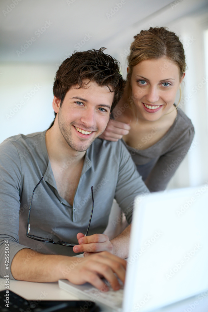 Young people studying from home with laptop computer Young people studying from home with laptop computer