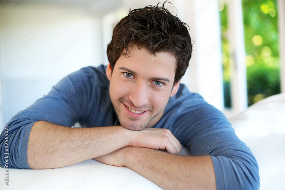 Closeup of attractive young man relaxing at home