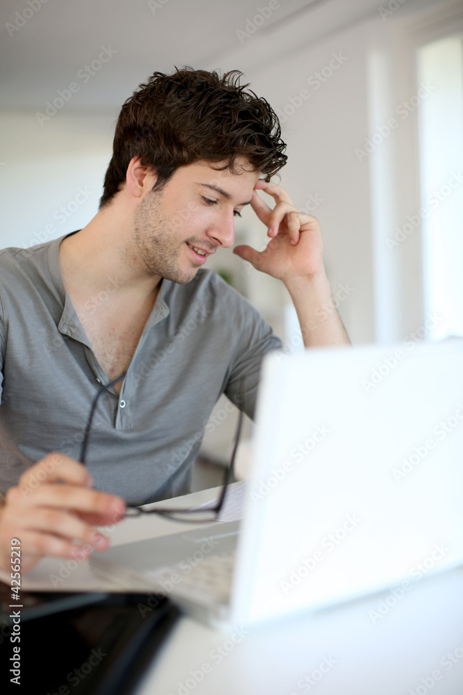 Young man studying from home Young man studying from home