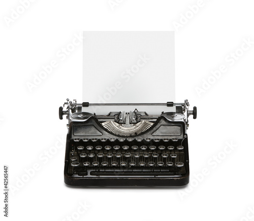 Retro rusty typewriter isolated on white background photo