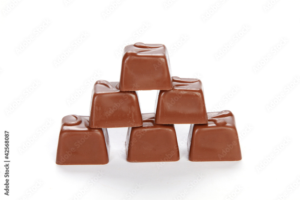 Broken chocolate tower isolated on white background Broken chocolate tower isolated on white background