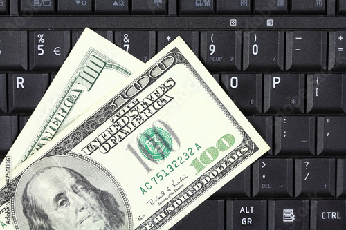 Online business - US dollars and keyboard