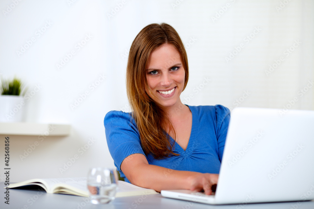 Beautiful blonde girl studying