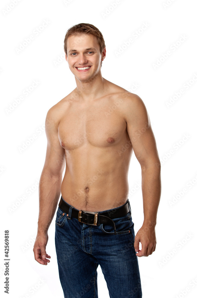 Cheerful young man in jeans with bare torso Cheerful young man in jeans with bare torso