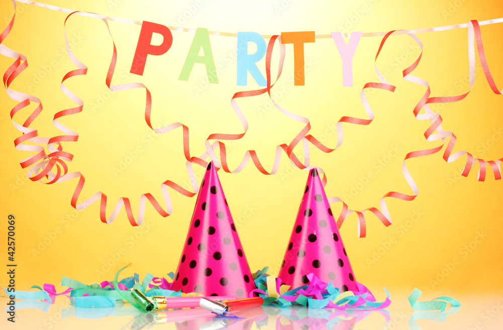 Party items on orange background Party items on orange background